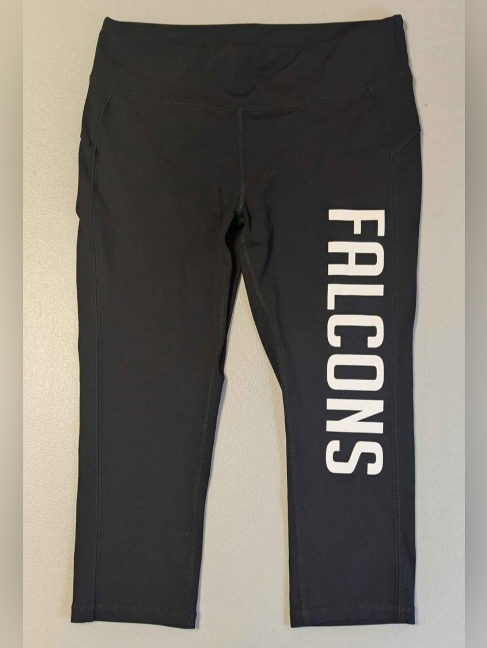 Alo medium leggings, Falcons on leg